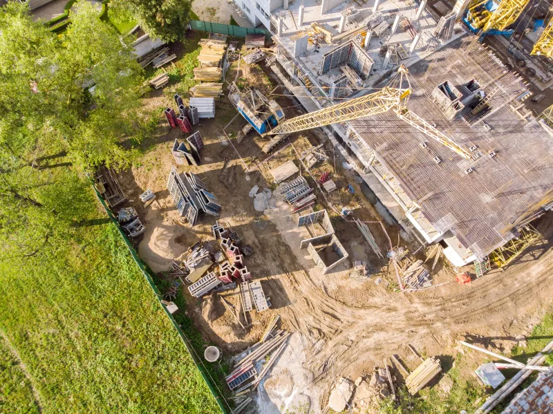 birds eye view of apartment building construction site in progress