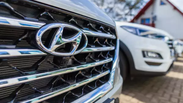 Hyundai logo on a Hyundai car at a car dealer