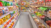 Well-stocked snack aisle in a bright modern supermarket