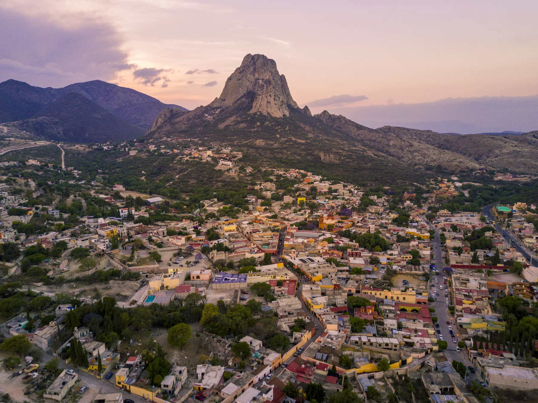 rock mountain with little town aerial