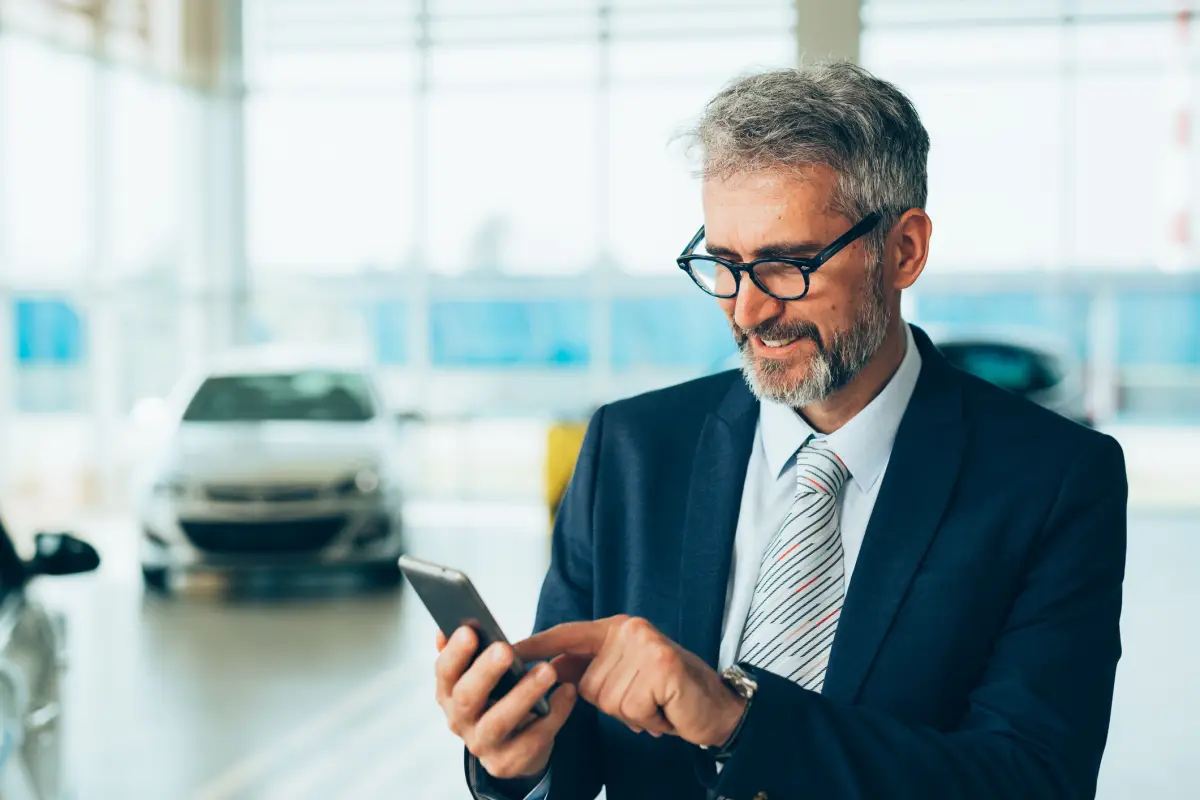 mid age manager at car dealership