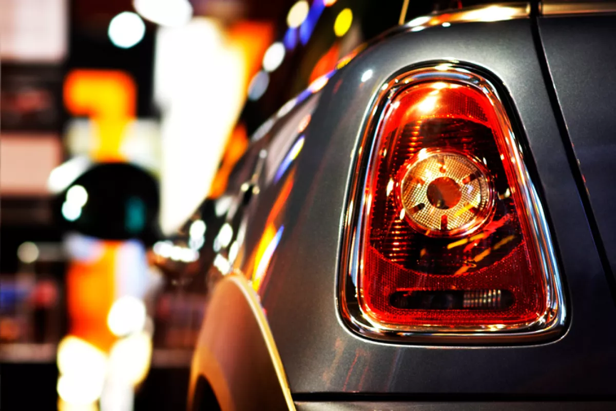 Mini Cooper vehicle at Night at public dealership shopping window