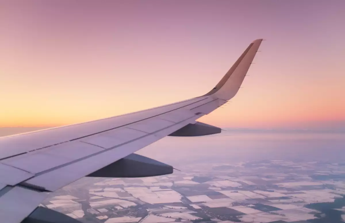 Aircraft wind on the sunrise sky background. Composition of aircraft