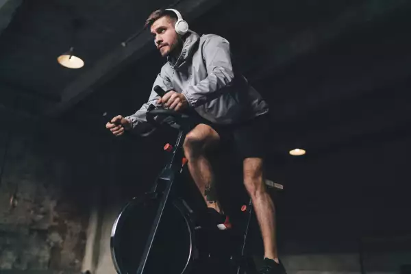 Low,Angle,Of,Young,Male,In,Headphones,Looking,Away,While