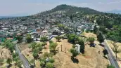 Imagen panorámica de la Ciudad de México en la que se observa la mancha urbana y terrenos deshabitados.