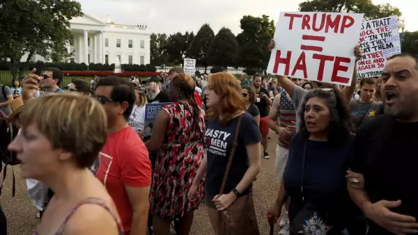 People gather for a vigil in response to the death of a counter-demonstrator