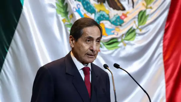 Mexican FM Rogelio Ramirez de la O delivers the 2025 proposed budget to the President of Mexico's Chamber of Deputies, Sergio Gutierrez Luna in Mexico City