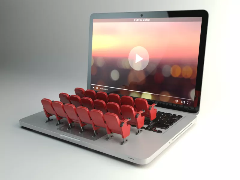 Video player app or home cinema concept. Laptop and seats