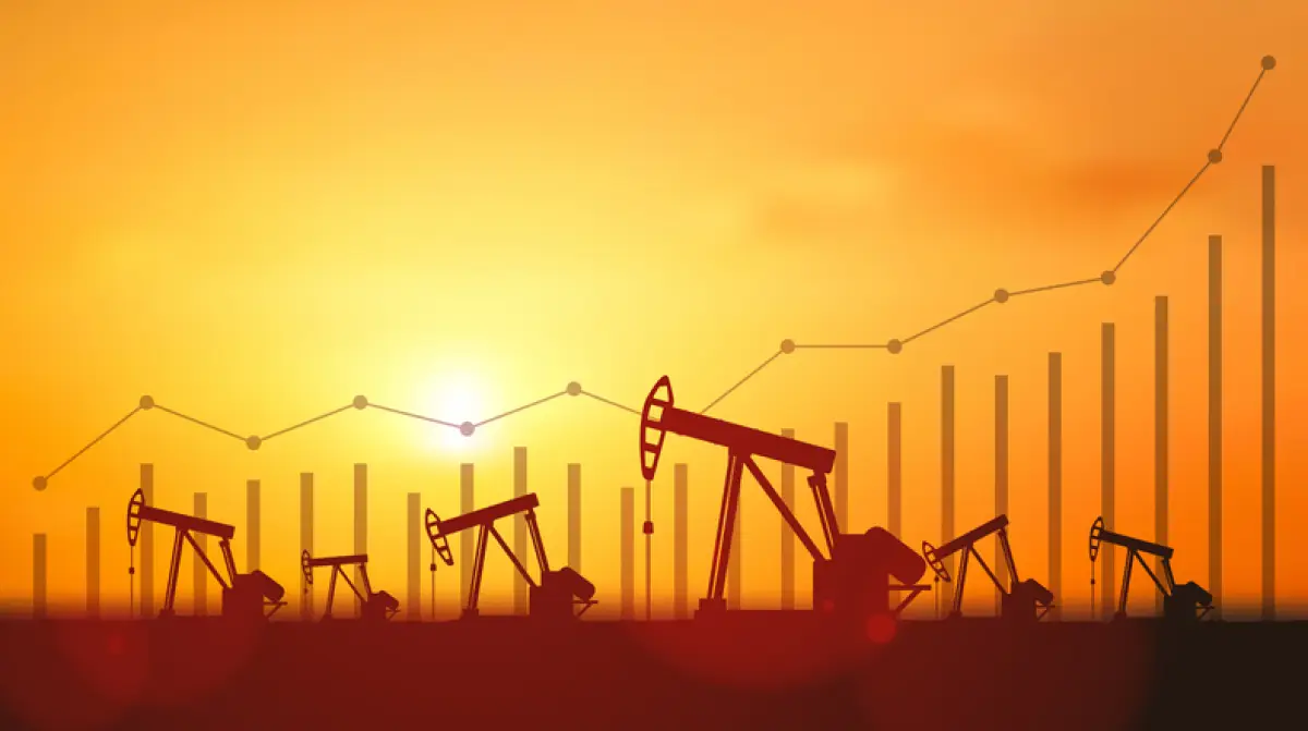 bombas de petroleo con gráfica ascendente al fondo