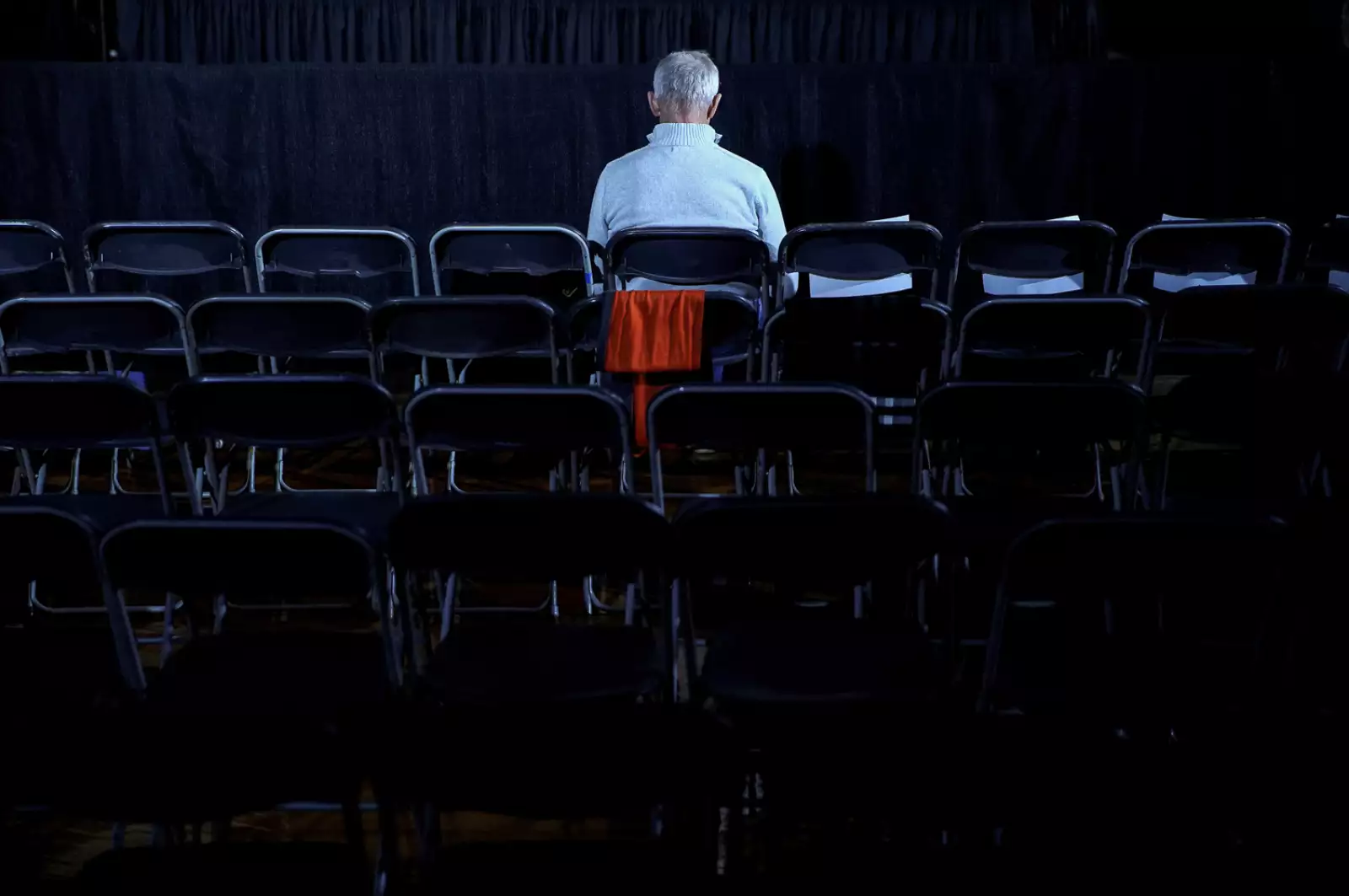 A man waits before the rally for Democratic presidential candidate Pete Buttigieg at Drake University in Des Moines in Des Moines, Iowa, U.S.,