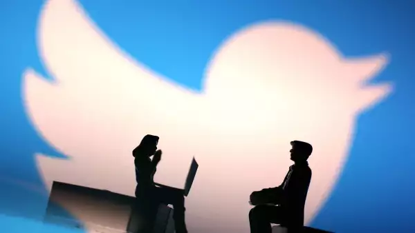 Illustration shows small figurines and Twitter logo