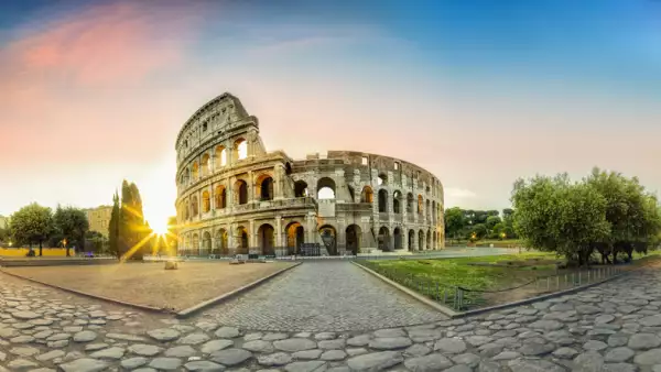 Colosseum in Rome and morning sun, Italy