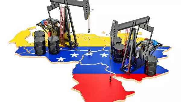 Venezuela map with oil barrels and pumpjacks. Oil production concept. 3D rendering