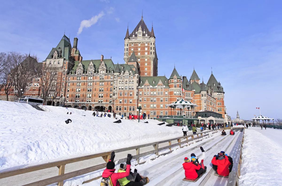 Chateau Frontenac in winter and traditional slide on the foreground, Quebec City