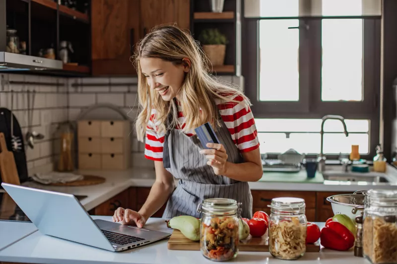 Young woman ordering food ingredients online