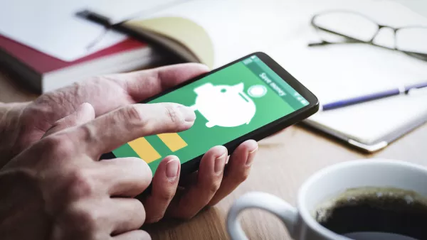 Piggy bank icon on smartphone screen.