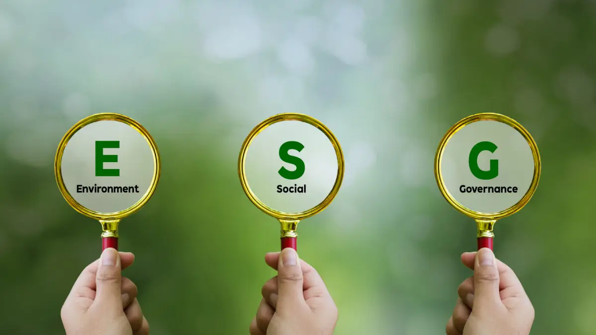 Words ESG. on magnifier glass with green backgroud. Concept of environmental, social and governance. Sustainable and ethical business. account the environment, society and corporate governance.