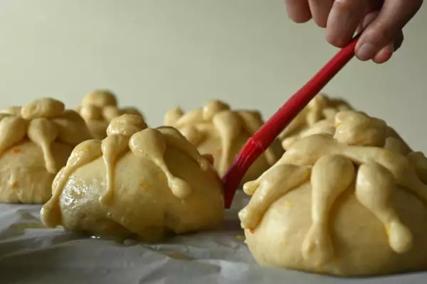Person preparing traditional pan de muerto