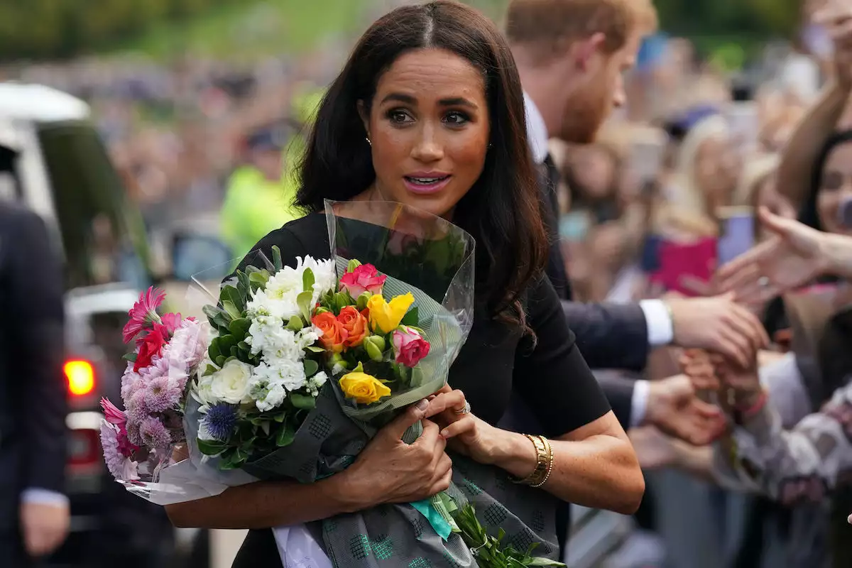 The Prince and Princess of Wales Accompanied By The Duke And Duchess Of Sussex Greet Wellwishers Outside Windsor Castle