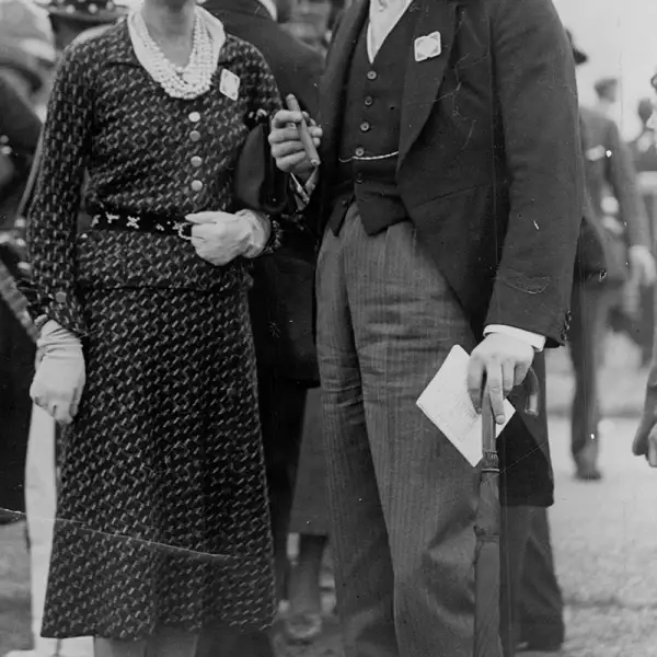 Politician Randolph Churchill With Fashion Designer Coco Chanel At Ascot Randolph Frederick Edward Spencer-churchill Mbe (28 May 1911 A 6 June 1968) Was The Son Of British Prime Minister Winston Churchill And His Wife Clementine. He Was A Conservativ