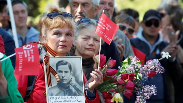 People mark the anniversary of the victory over Nazi Germany in World War Two in Mariupol