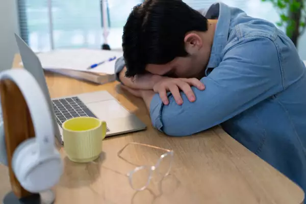 Young Asian businessman working at home