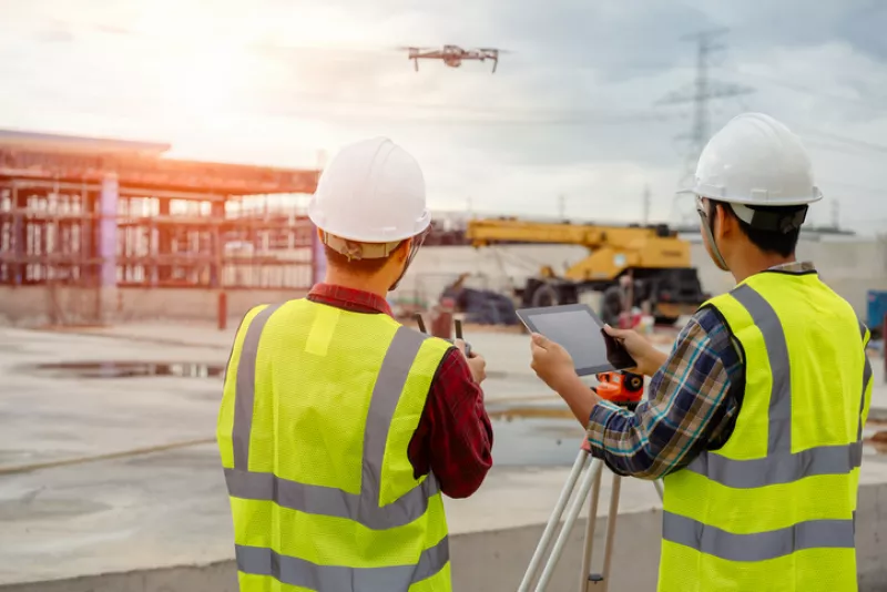 Drone operated by construction worker.