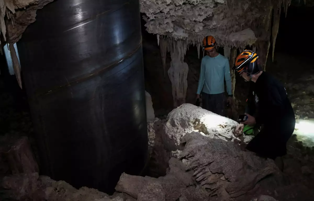 Activists from the group Cenotes Urbanos explore the underground caves of the Aktun T'uyul System, in Playa del Carmen