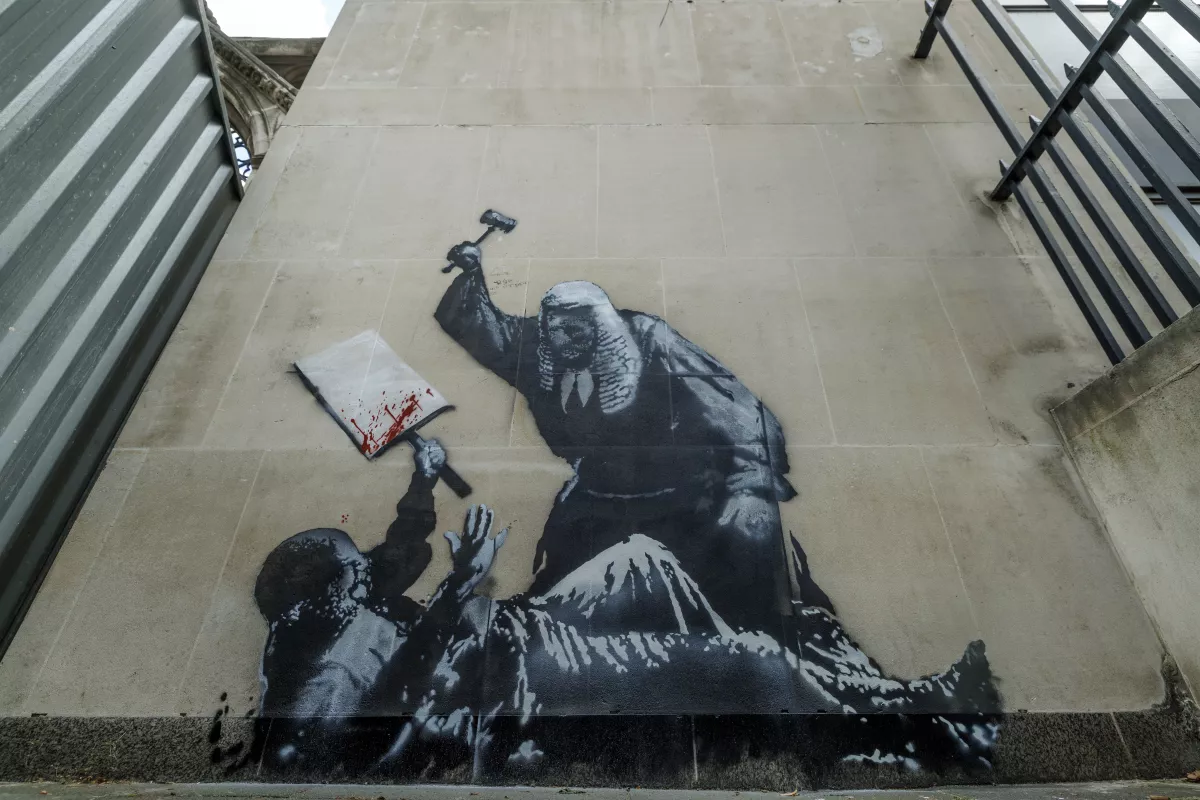 Latest Banksy Mural Covered And Guarded By Security At The Royal Courts Of Justice