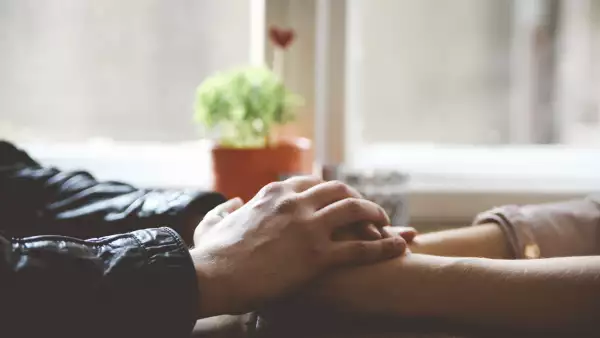 Couple holding hands