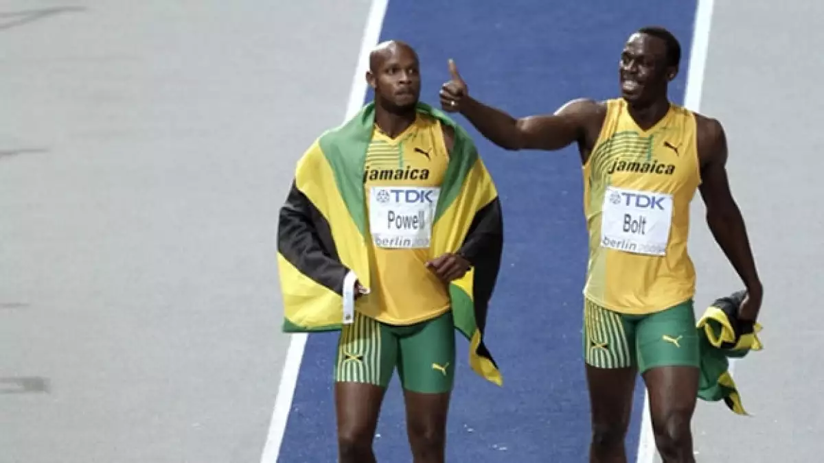 Usain Bolt y Asafa Powell tras una carrera