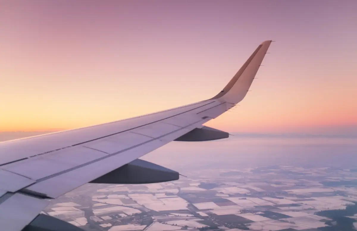 Aircraft wind on the sunrise sky background. Composition of aircraft