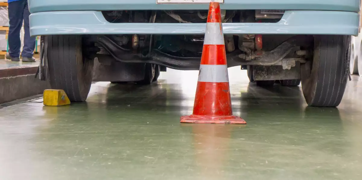 Front truck with wheels stopper, No movement car with traffic cone during goods loading