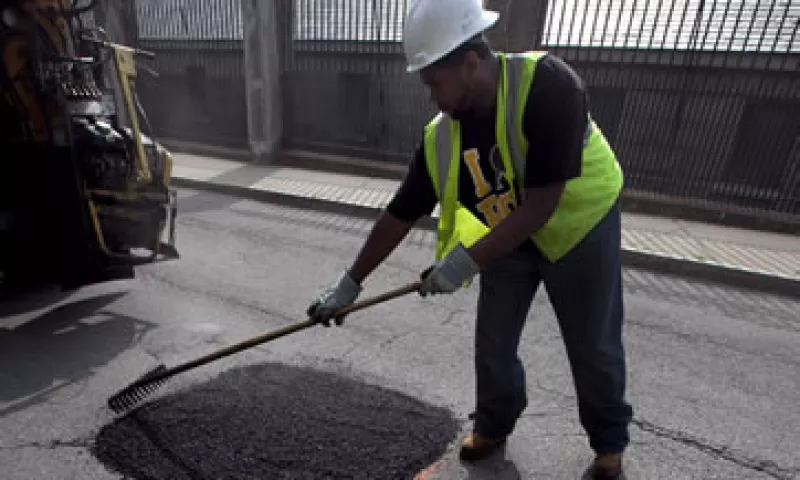 Los empleados de Boston rellenan unos 19,000 baches al año. (Foto: AP)