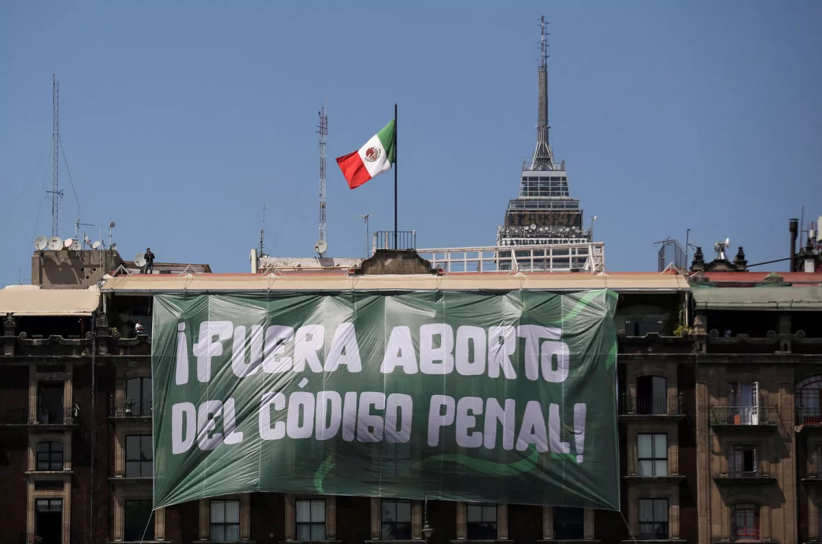 FILE PHOTO: A banner reading: "Abortion Out of the Penal Code" hangs from a building during International Women's Day, at the Zocalo Square in Mexico City, Mexico March 8, 2023. REUTERS/Quetzalli Nicte-Ha/