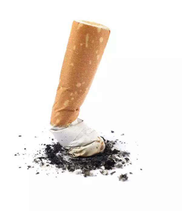 Extinguished cigarette butt isolated on white background