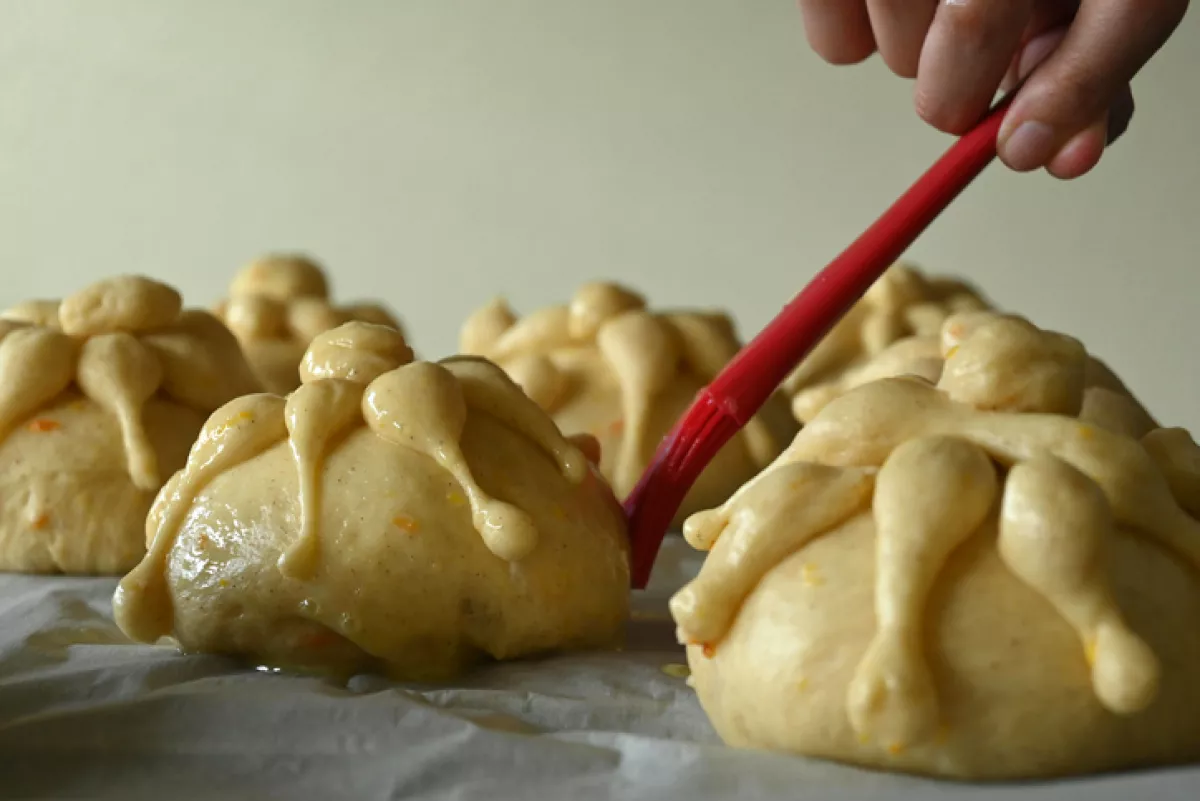 Person preparing traditional pan de muerto