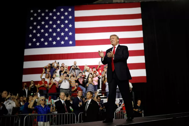 President Donald Trump acknowledges the crowd during the Make America Great Again Rally at the Florida State Fairgrounds in Tampa