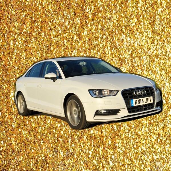 Sprinkle glitter gold dust on a black background with copy space