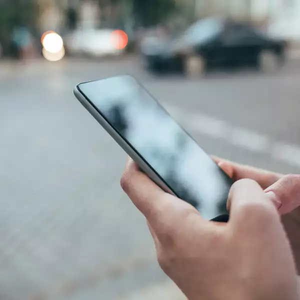 Woman's hands holding smart phone
