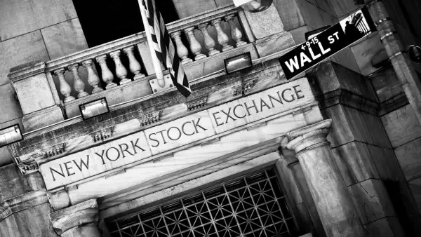 New York Stock Exchange entrance with Wall Street sign
