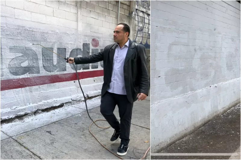 Un legislador del PAN pinta de blanco una barda de apoyo a la jefa de gobierno