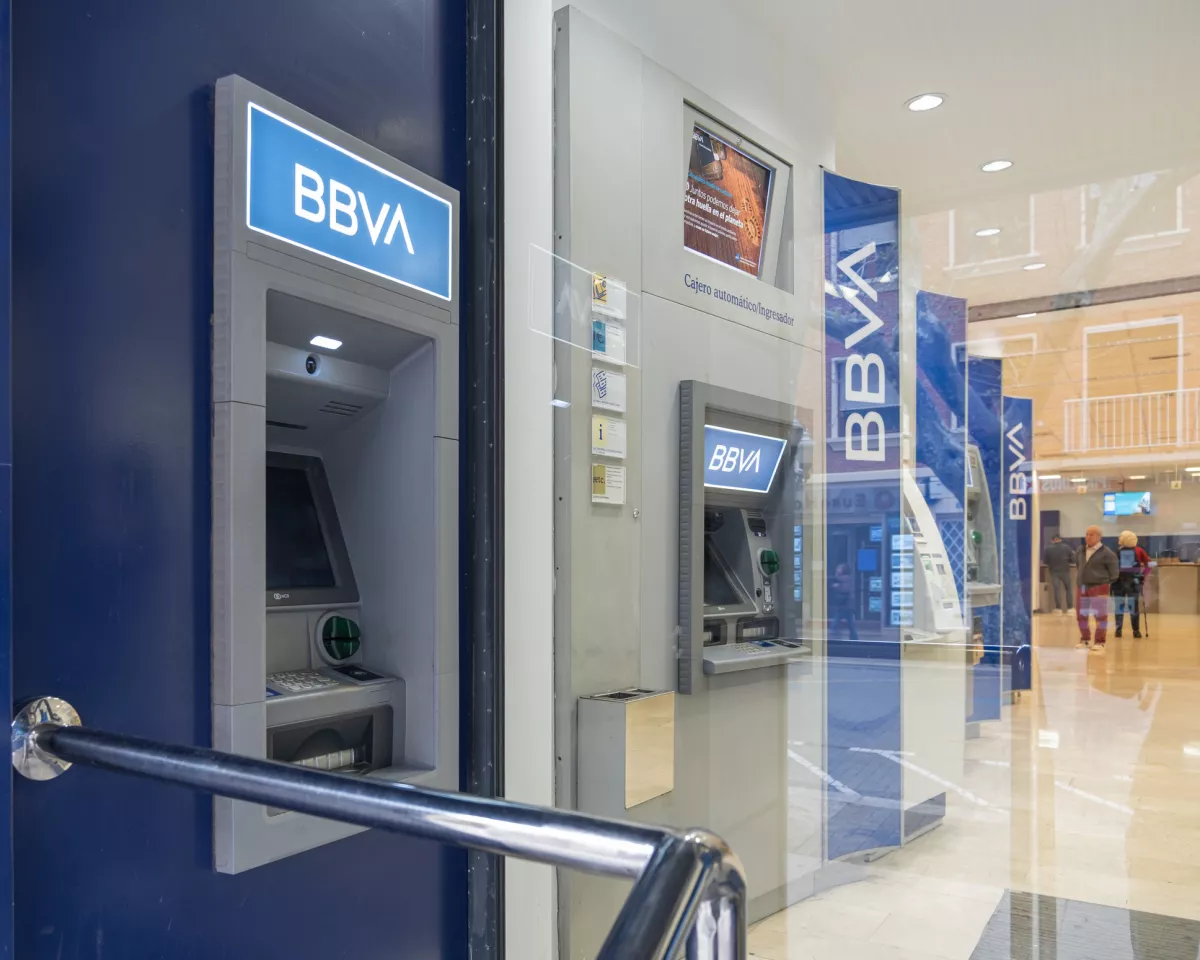 Outside and inside ATM's in a BBVA office in the center of Denia (Alicante). Horizontal composition.