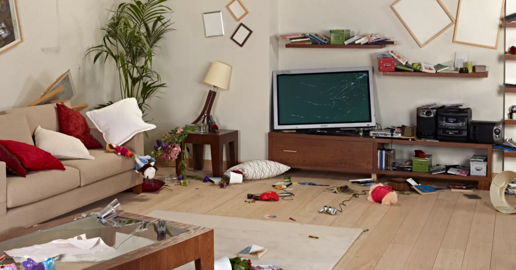 messy living room with damage