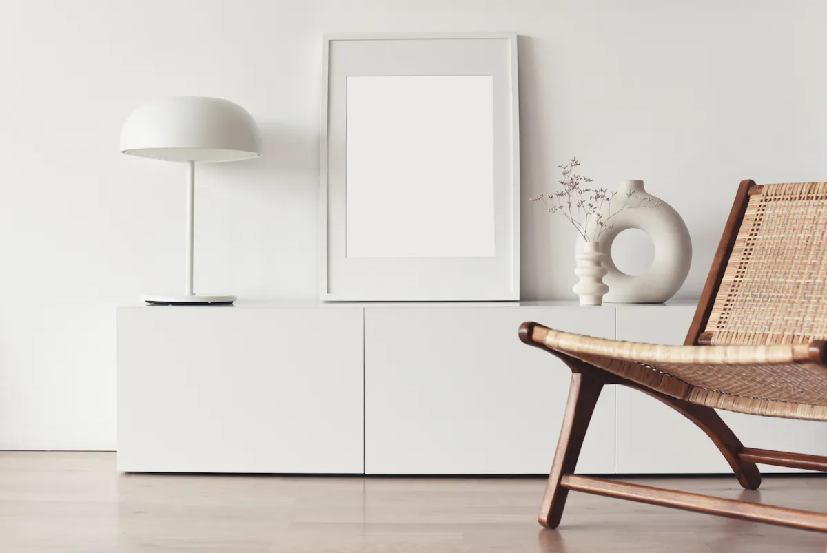 Blank picture frame mockup on white wall. Living room design