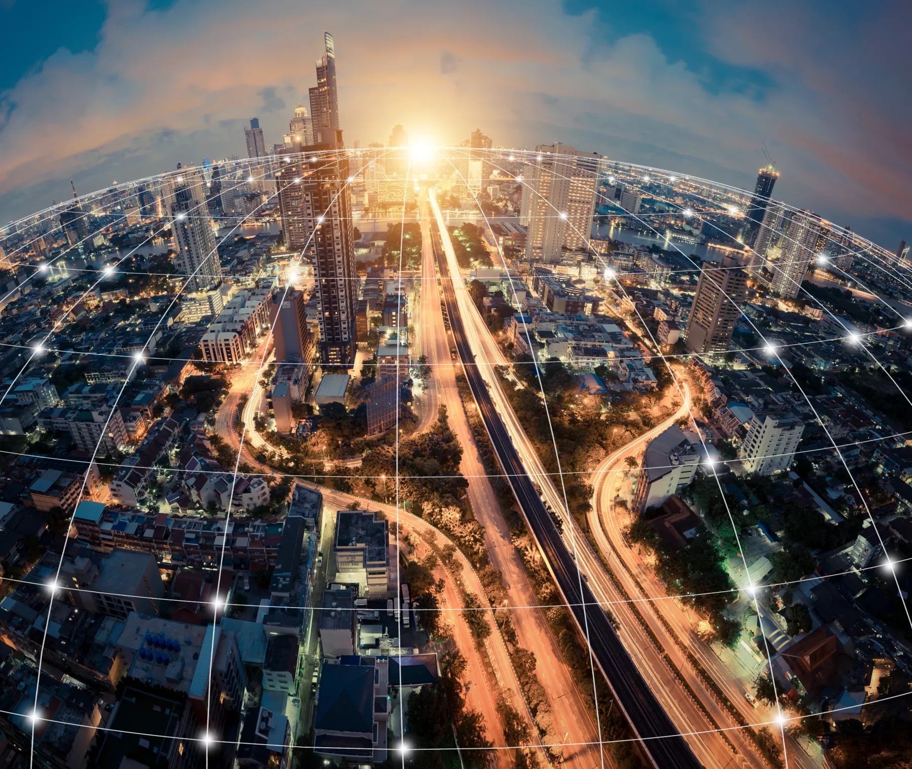 Digital network connection lines of Sathorn road, Bangkok Downtown, Thailand. Financial district and business centers in smart urban city in Asia. Skyscraper and high-rise buildings at night.
