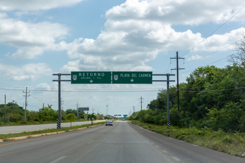 Mexican highway with green signs road