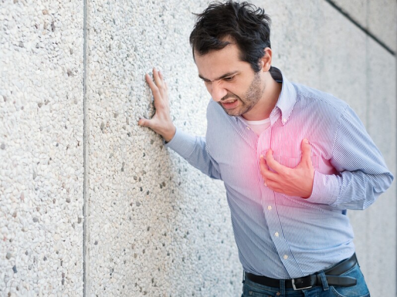 Man feeling a big pain on the chest and collapsing
