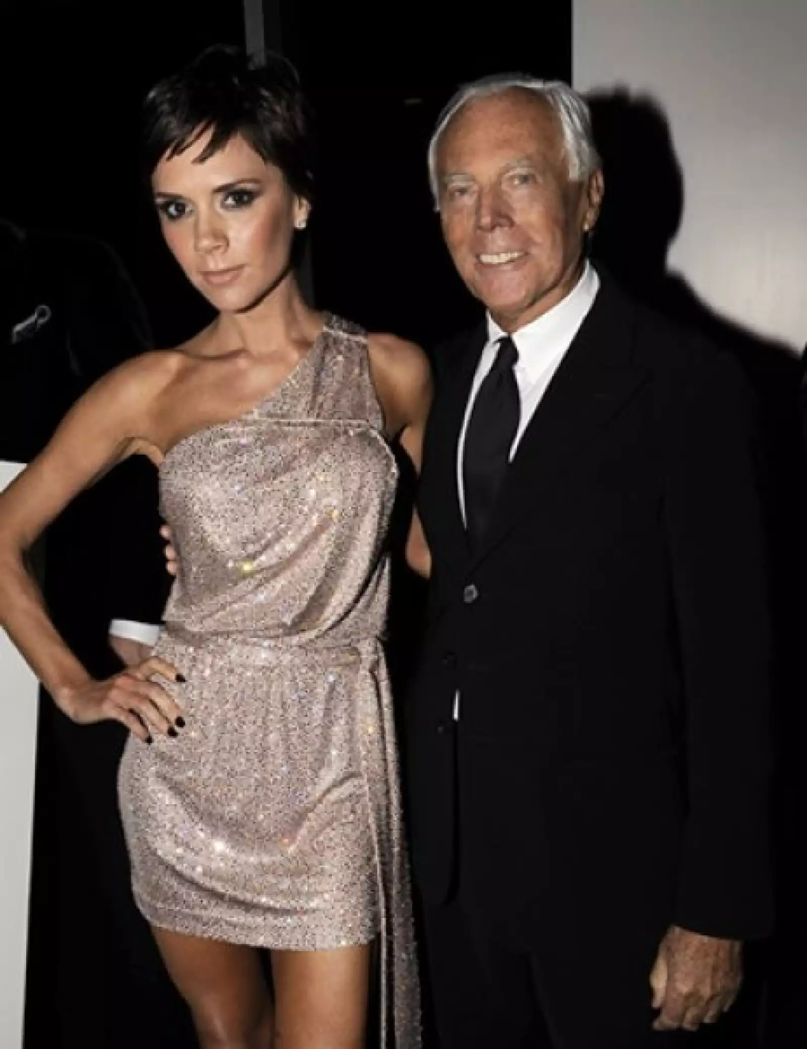 Victoria Beckham y Giorgio Armani