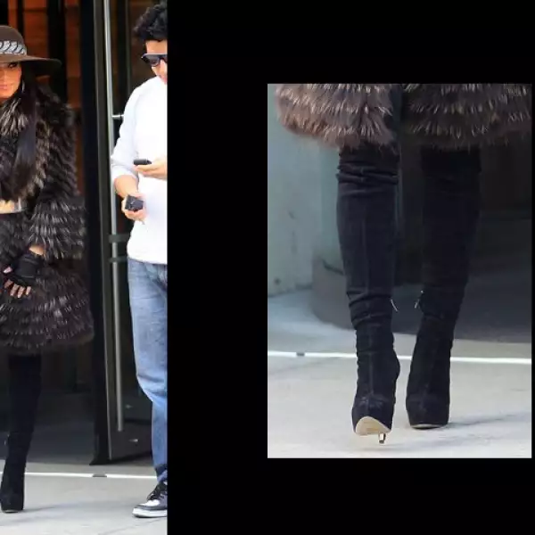 Kim Kardashian se ve súper chic con sus knee high boots de gamuza negra.